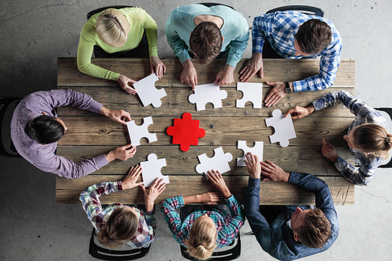 Business people and puzzle